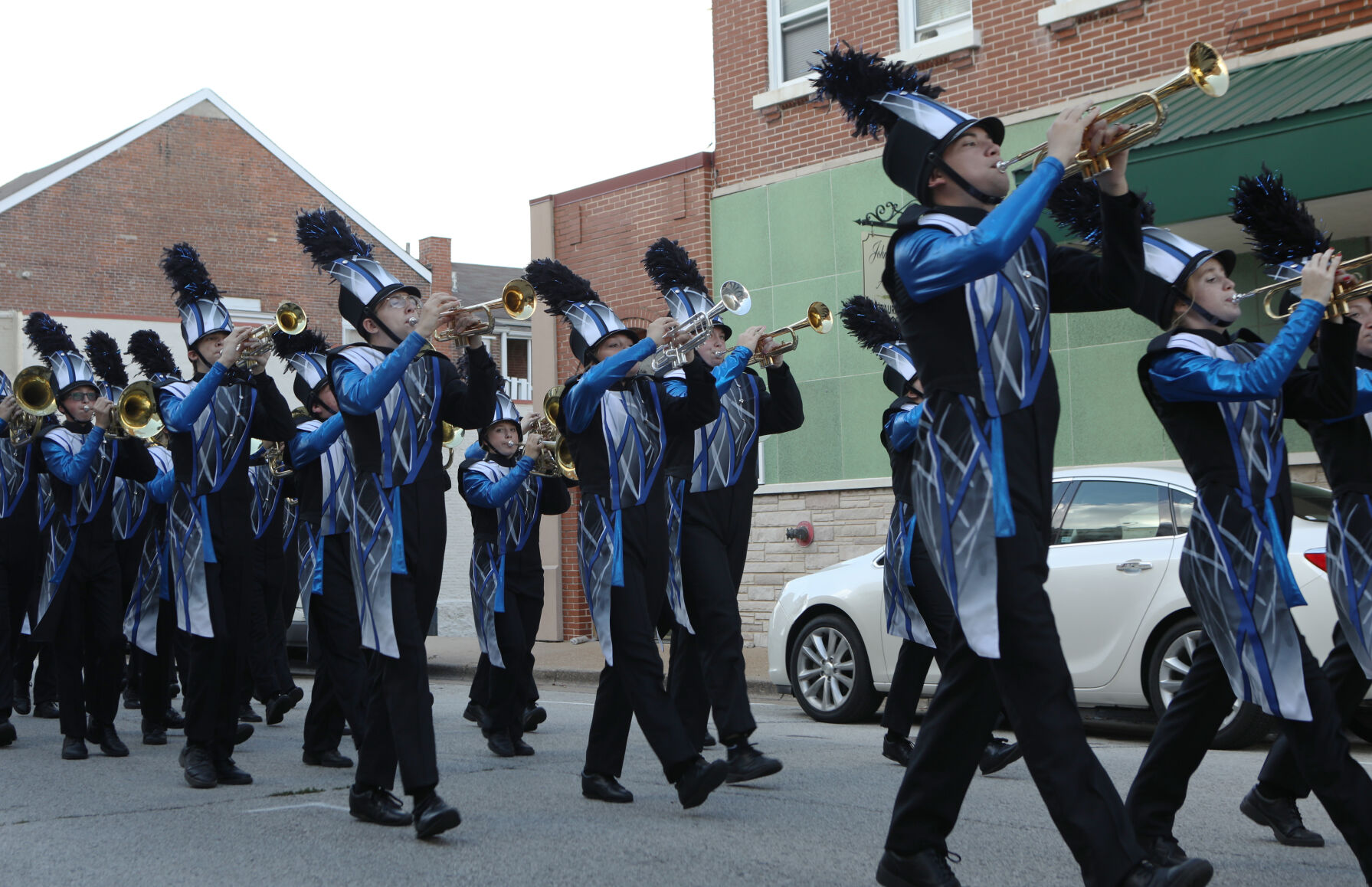 Marching band members perform